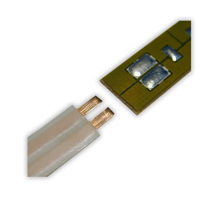 Soldering of a ribbon cable on a PCB. 

Hot Bar Soldering with flat soldering bar. 

The positioning of the flex foil on the soldering pads of the PCB is realised with alignment pins and corresponding drillings in flex and PCB.