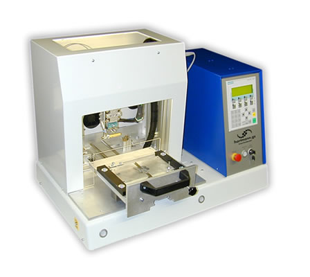 Hot Bar Soldering System with sliding table (Desktop-Edition).

With exchangeable base plate on the sliding table for different jigs and workpiece holders. Dimensions of sliding table: 250x250mm.

The workpiece holder can be loaded in the extracted state of the sliding table. Standard: Manual movement of the sliding table.

Option: Automatic drive
The table is locked automatically and the Hot Bar Soldering process is initiated.

The system enclosure is available in different versions (e.g. ESD acryl glass or profile enclosure with safety door).

Semi-gimballed suspension of the soldering bar for best possible co-planar pressure of the soldering bar on the solder joint (for the soldering of plane solder joints).

Precise linear guide for stranded wire- or cable solderings. Adjustable pressure for both options. 
 
Quick-change system for soldering bars with plug-in connector and mounting device on a pneumatic lifting unit. Change of the soldering bar in <2min.

Active air cooling of the soldering bar at the end of a soldering process.

Duplicated design of temperature control system, incorporating redundancy, with additional thermocouple at the soldering bar.

Complex monitoring capabilities of the programmed soldering profile. The system control is via a standard PLC with control panel.

Customized adjustments, the integration of additional functions and controls of additional processes can be easily implemented.

Various setting parameters, e.g. heating profile, heating times, heating temperatures, temperature gradients, cooling process, lifting temperature, storing of different product and parameter settings, different quantity-, cycle- and OK/NOK counters, automatic calibration for new soldering bars etc.

For the standard system, numerous additional functions are available:

Customized product jigs
Permanent force measurement and -monitoring of the soldering process.

Path measurement system for measuring the height of parts and the sinking results.

Flux application systems (manual and automatic).

Camera and monitor to support the operator Data communication and data storage of all parameters and measured values in the soldering process.

Components for remote maintenance to grant our technicians access to the PLC control for diagnostics and programming.

Automatic Kapton foil feeder
Integrated automatic cleaning station for the soldering bar.

Measurement dummies for reproducible measuring of temperature, path and force (for machine capability studies, cmk/cpk-evaluation).

Necessary compressed air supply: 5 Bar, Emergency-Stop function, CE mark of conformity