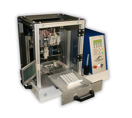 Hot Bar Soldering System with sliding table (Desktop-Edition).

With exchangeable base plate on the sliding table for different jigs and workpiece holders. Dimensions of sliding table: 250x250mm.

The workpiece holder can be loaded in the extracted state of the sliding table. Standard: Manual movement of the sliding table.

Option: Automatic drive
The table is locked automatically and the Hot Bar Soldering process is initiated.

The system enclosure is available in different versions (e.g. ESD acryl glass or profile enclosure with safety door).

Semi-gimballed suspension of the soldering bar for best possible co-planar pressure of the soldering bar on the solder joint (for the soldering of plane solder joints).

Precise linear guide for stranded wire- or cable solderings. Adjustable pressure for both options. 
 
Quick-change system for soldering bars with plug-in connector and mounting device on a pneumatic lifting unit. Change of the soldering bar in <2min.

Active air cooling of the soldering bar at the end of a soldering process.

Duplicated design of temperature control system, incorporating redundancy, with additional thermocouple at the soldering bar.

Complex monitoring capabilities of the programmed soldering profile. The system control is via a standard PLC with control panel.

Customized adjustments, the integration of additional functions and controls of additional processes can be easily implemented.

Various setting parameters, e.g. heating profile, heating times, heating temperatures, temperature gradients, cooling process, lifting temperature, storing of different product and parameter settings, different quantity-, cycle- and OK/NOK counters, automatic calibration for new soldering bars etc.

For the standard system, numerous additional functions are available:

Customized product jigs
Permanent force measurement and -monitoring of the soldering process.

Path measurement system for measuring the height of parts and the sinking results.

Flux application systems (manual and automatic).

Camera and monitor to support the operator Data communication and data storage of all parameters and measured values in the soldering process.

Components for remote maintenance to grant our technicians access to the PLC control for diagnostics and programming.

Automatic Kapton foil feeder
Integrated automatic cleaning station for the soldering bar.

Measurement dummies for reproducible measuring of temperature, path and force (for machine capability studies, cmk/cpk-evaluation).

Necessary compressed air supply: 5 Bar, Emergency-Stop function, CE mark of conformity