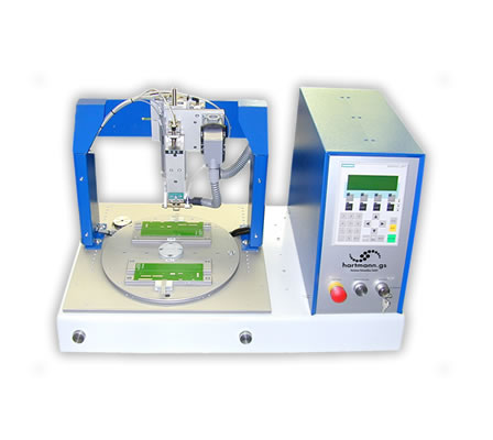 Hot Bar Soldering System with automatic rotary table (Desktop-edition).

Diameter of turntable: 330mm.

On the turntable of the system there are mounting possibilities for 2 product jigs.

Simultanous loading / unloading and soldering. The turntable is actuated by a drive wheel, launched by a two-handed release.

The turntable is locked automatically and the Hot Bar Soldering process is initiated.

The system enclosure is available in different versions (e.g. ESD acryl glass or profile enclosure with safety door).

Semi-gimballed suspension of the soldering bar for best possible co-planar pressure of the soldering bar on the solder joint (for the soldering of plane solder joints).

Precise linear guide for stranded wire- or cable solderings. Adjustable pressure for both options. 
 
Quick-change system for soldering bars with plug-in connector and mounting device on a pneumatic lifting unit. Change of the soldering bar in <2min.

Active air cooling of the soldering bar at the end of a soldering process.

Duplicate design of temperature control system, incorporating redundancy, with additional thermocouple at the soldering bar.

Complex monitoring capabilities of the programmed soldering profile.

The system control is via a standard PLC with control panel.

Customized adjustments, the integration of additional functions and controls of additional processes can be easily implemented.

Various setting parameters, e.g. heating profile, heating times, heating temperatures, temperature gradients, cooling process, lifting temperature, storing of different product and parameter settings, different quantity-, cycle- and OK/NOK counters, automatic calibration for new soldering bars etc.

For the standard system, numerous additional functions are available:

Customized product jigs.

Permanent force measurement and -monitoring of the soldering process.

Path measurement system for measuring the height of parts and the sinking results.

Flux application systems (manual and automatic).

Camera and monitor to support the operator.

Data communication and data storage of all parameters and measured values in the soldering process.

Components for remote maintenance to grant our technicians access to the PLC control for diagnostics and programming.

Automatic Kapton foil feeder.

Integrated automatic cleaning station for the soldering bar.

Measurement dummies for reproducible measuring of temperature, path and force (for machine capability studies, cmk/cpk-evaluation).

Necessary compressed air supply: 5 Bar, Emergency-Stop function, CE mark of conformity.