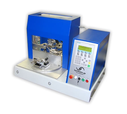 Hot Bar Soldering System with automatic rotary table Desktop-edition.

Diameter of turntable: 330mm.

On the turntable of the system there are mounting possibilities for 2 product jigs.

Simultanous loading / unloading and soldering.

The turntable is actuated by a drive wheel, launched by a two-handed release.

The turntable is locked automatically and the Hot Bar Soldering process is initiated.

The system enclosure is available in different versions (e.g. ESD acryl glass or profile enclosure with safety door).

Semi-gimballed suspension of the soldering bar for best possible co-planar pressure of the soldering bar on the solder joint (for the soldering of plane solder joints).

Precise linear guide for stranded wire- or cable solderings. Adjustable pressure for both options. 
 
Quick-change system for soldering bars with plug-in connector and mounting device on a pneumatic lifting unit. Change of the soldering bar in <2min.

Active air cooling of the soldering bar at the end of a soldering process.

Duplicate design of temperature control system, incorporating redundancy, with additional thermocouple at the soldering bar.

Complex monitoring capabilities of the programmed soldering profile.

The system control is via a standard PLC with control panel.

Customized adjustments, the integration of additional functions and controls of additional processes can be easily implemented.

Various setting parameters, e.g. heating profile, heating times, heating temperatures, temperature gradients, cooling process, lifting temperature, storing of different product and parameter settings, different quantity-, cycle- and OK/NOK counters, automatic calibration for new soldering bars etc.

For the standard system, numerous additional functions are available:

Customized product jigs.

Permanent force measurement and -monitoring of the soldering process.

Path measurement system for measuring the height of parts and the sinking results.

Flux application systems (manual and automatic).

Camera and monitor to support the operator.

Data communication and data storage of all parameters and measured values in the soldering process.

Components for remote maintenance to grant our technicians access to the PLC control for diagnostics and programming.

Automatic Kapton foil feeder.

Integrated automatic cleaning station for the soldering bar.

Measurement dummies for reproducible measuring of temperature, path and force (for machine capability studies, cmk/cpk-evaluation).

Necessary compressed air supply: 5 Bar, Emergency-Stop function, CE mark of conformity.